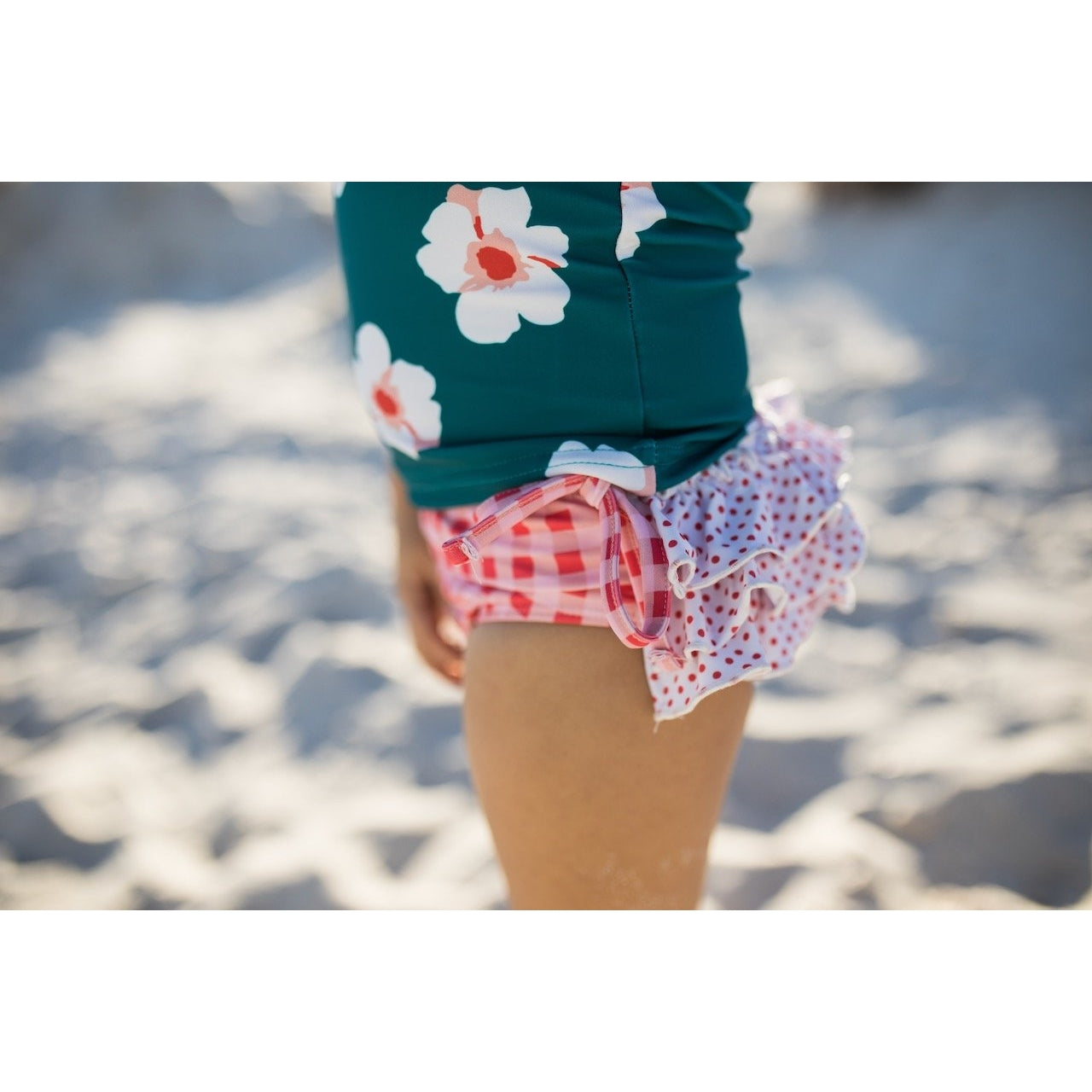 Oopsie Daisy Teal and Coral Ruffle Rash Guard